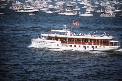 The Sequoia, the former presidential yacht, passes in review during the International Naval Review celebrating the centennial of the Statue of Liberty, New York Harbor, 4 July 1986. Photograph by PH1 R.E. Kerns.